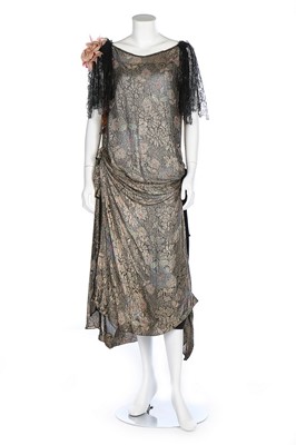 Lot 193 - A floral printed lamé evening gown, mid 1920s,...