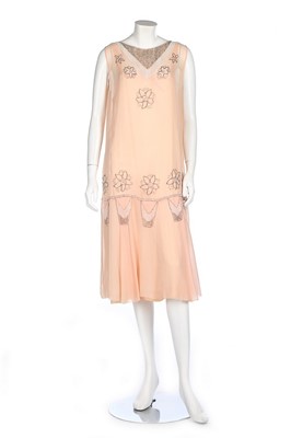 Lot 195 - A pale pink chiffon cocktail dress, circa 1929,...