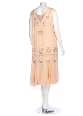 Lot 195 - A pale pink chiffon cocktail dress, circa 1929,...