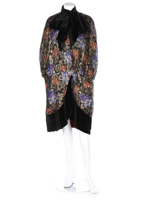 Lot 198 - A printed and brocaded lamé opera cape, 1920s,...