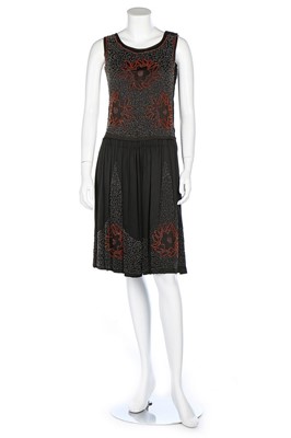 Lot 199 - A beaded dark brown/black satin flapper dress,...