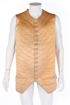 Lot 93 - Two waistcoats, one of quilted peach satin...