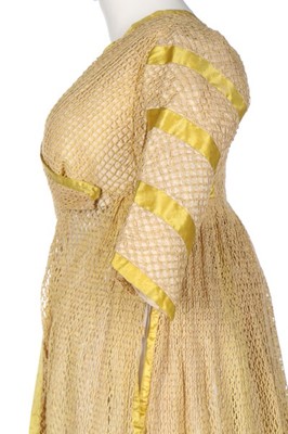 Lot 94 - An unusual cotton filet mesh open robe,...