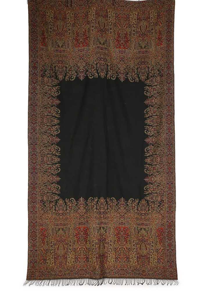 Lot 454 - A black ground long shawl, Norwich, 1840s,...