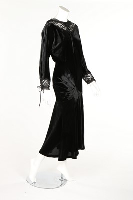 Lot 183 - An Ossie Clark black velvet bias cut dress,...