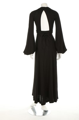 Lot 201 - An Ossie Clark black wool jersey 'Cuddly' wrap-...