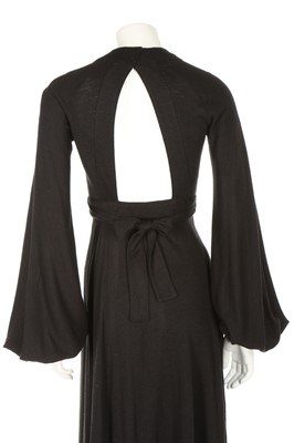 Lot 201 - An Ossie Clark black wool jersey 'Cuddly' wrap-...
