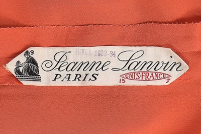 Lot 90 - A Jeanne Lanvin couture coral silk crêpe de...