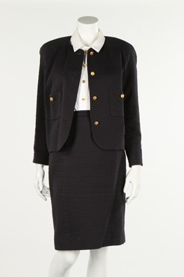 Lot 226 - A Chanel boutique navy piqué suit, 1990s,...