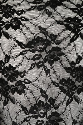 Lot 30 - An Ossie Clark black silk jersey evening gown,...
