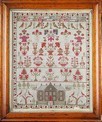 Lot 66 - An embroidered house sampler, by Margaret...