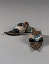 Lot 285 - A pair of damask silk and leather pattens,...