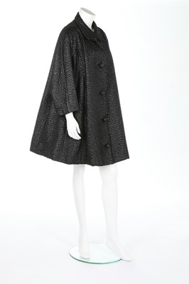 Lot 225 - A fine Balenciaga couture black ciré matelassé...