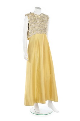 Lot 233 - A Lesage embroidered yellow ziberline evening...