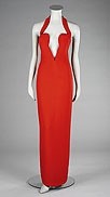 Lot 443 - A Gianni Versace red crhalter-neck evening...