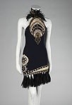 Lot 479 - A Gianni Versace black silk crêpe cocktail...