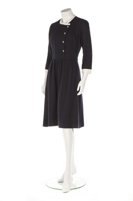 Lot 32 - A Chanel navy bouclé mid-length coat, 1990s,...