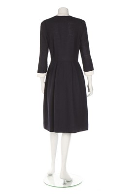 Lot 32 - A Chanel navy bouclé mid-length coat, 1990s,...