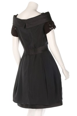 Lot 37 - A Versace black silk cocktail dress, late...