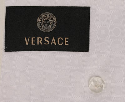Lot 37 - A Versace black silk cocktail dress, late...