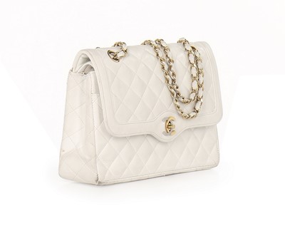 Lot 13 - A Chanel white quilted leather handbag, 1980s,...