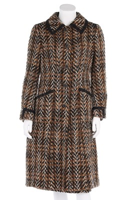 Lot 272 - A Chanel couture brown tweed ensemble, 1971,...