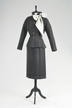 Lot 103 - A Madame Grsteel grey wool suit, 1950-52, the...