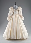 Lot 255 - An Emanuel ivory paper taffeta bridal gown...