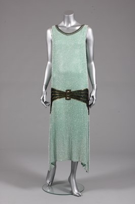 Lot 119 - A pale green beaded evening gown, circa 1929,...
