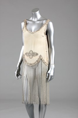 Lot 124 - A Paul Poiret beaded ivory silk crepe de chine...