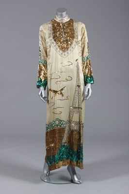 Lot 131 - A sequined yellow satin kaftan with the Eiffel...