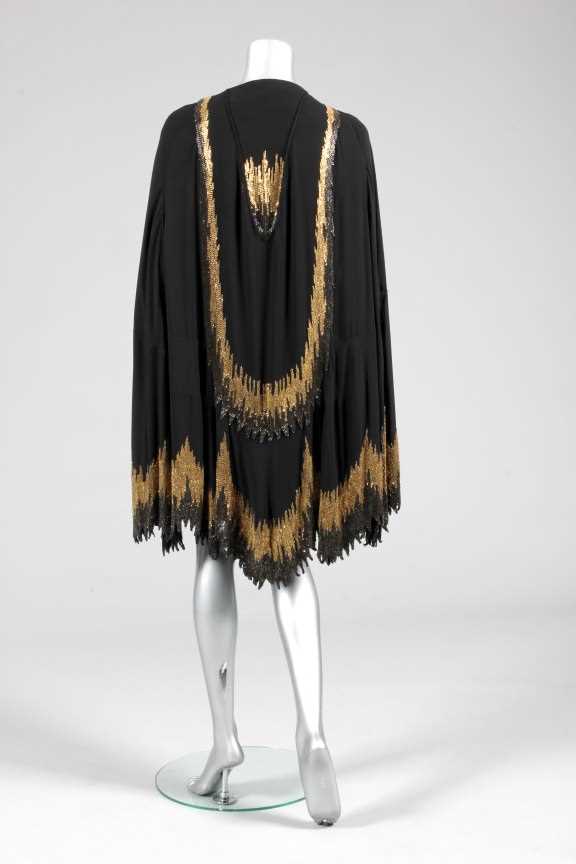 Lot 215 - A Chanel couture beaded cape, circa 1927, the...