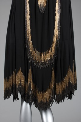 Lot 215 - A Chanel couture beaded cape, circa 1927, the...