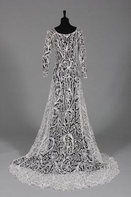 Lot 111 - An elaborate tapelace dress, circa 1900,...
