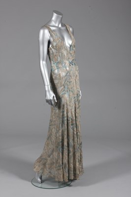 Lot 112 - A printed chiffon evening gown, early 1930s,...