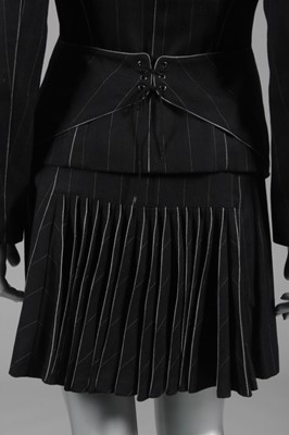 Lot 230 - An Azzedine Alaïa striped charcoal wool suit,...