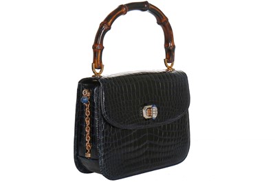 Lot 8 - A fine and rare Gucci ink-blue crocodile handbag with bamboo handle, 1960s