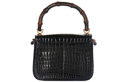 Lot 8 - A fine and rare Gucci ink-blue crocodile handbag with bamboo handle, 1960s
