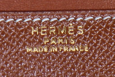 Lot 1 - An Hermès Ardennes leather Sac Doggy Medor cross-body bag, 1990s