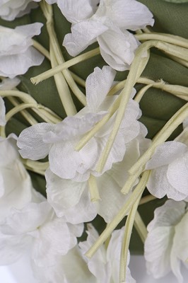 Lot 256 - A Christian Dior hat covered in white blooms, circa 1960