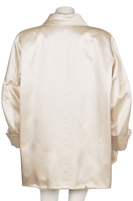 Lot 179 - An Yves Saint Laurent couture ivory satin evening jacket, probably Spring-Summer 1988