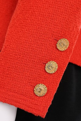 Lot 8 - A Chanel orange and black wool suit, early...