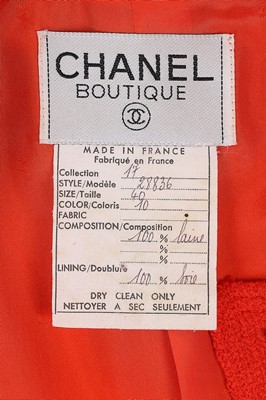 Lot 8 - A Chanel orange and black wool suit, early...