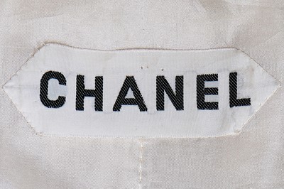 Lot 15 - A Chanel couture oatmeal and ivory tweed suit, 1969