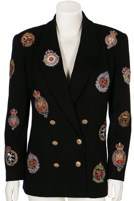 Lot 19 - A Chanel by Karl Lagerfeld black wool blazer covered with embroidered badges, A/W 1988-89
