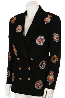 Lot 19 - A Chanel by Karl Lagerfeld black wool blazer covered with embroidered badges, A/W 1988-89