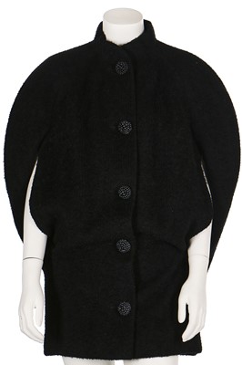 Lot 93 - A Traina-Norell black boucle wool cocoon-shaped cape, late 1950s