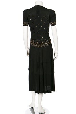 Lot 74 - Seven mainly black crêpe dinner dresses, 1940s