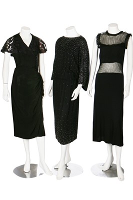 Lot 74 - Seven mainly black crêpe dinner dresses, 1940s