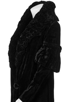 Lot 30 - A black velvet evening coat with Chinese embroidered skirt panel to lining, 1930